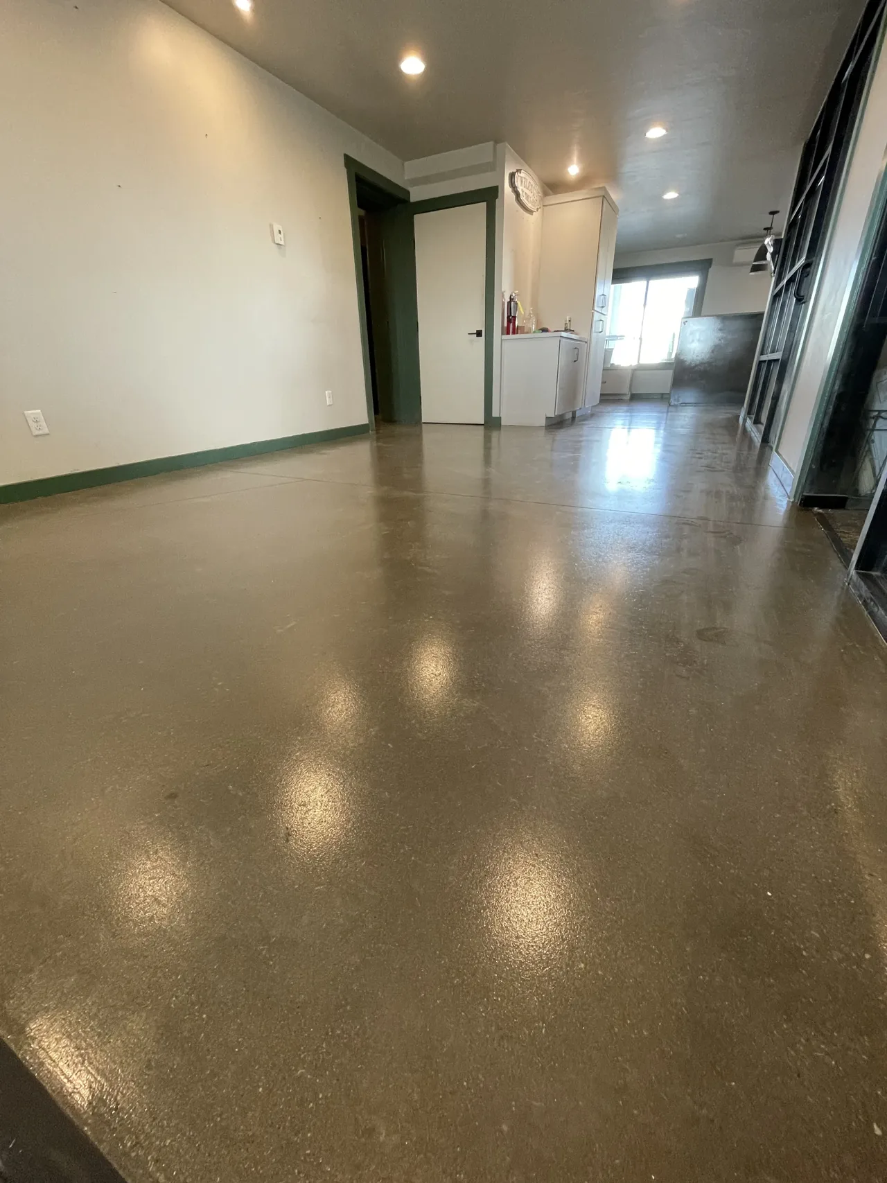 Brown-toned concrete floor in an interior hallway