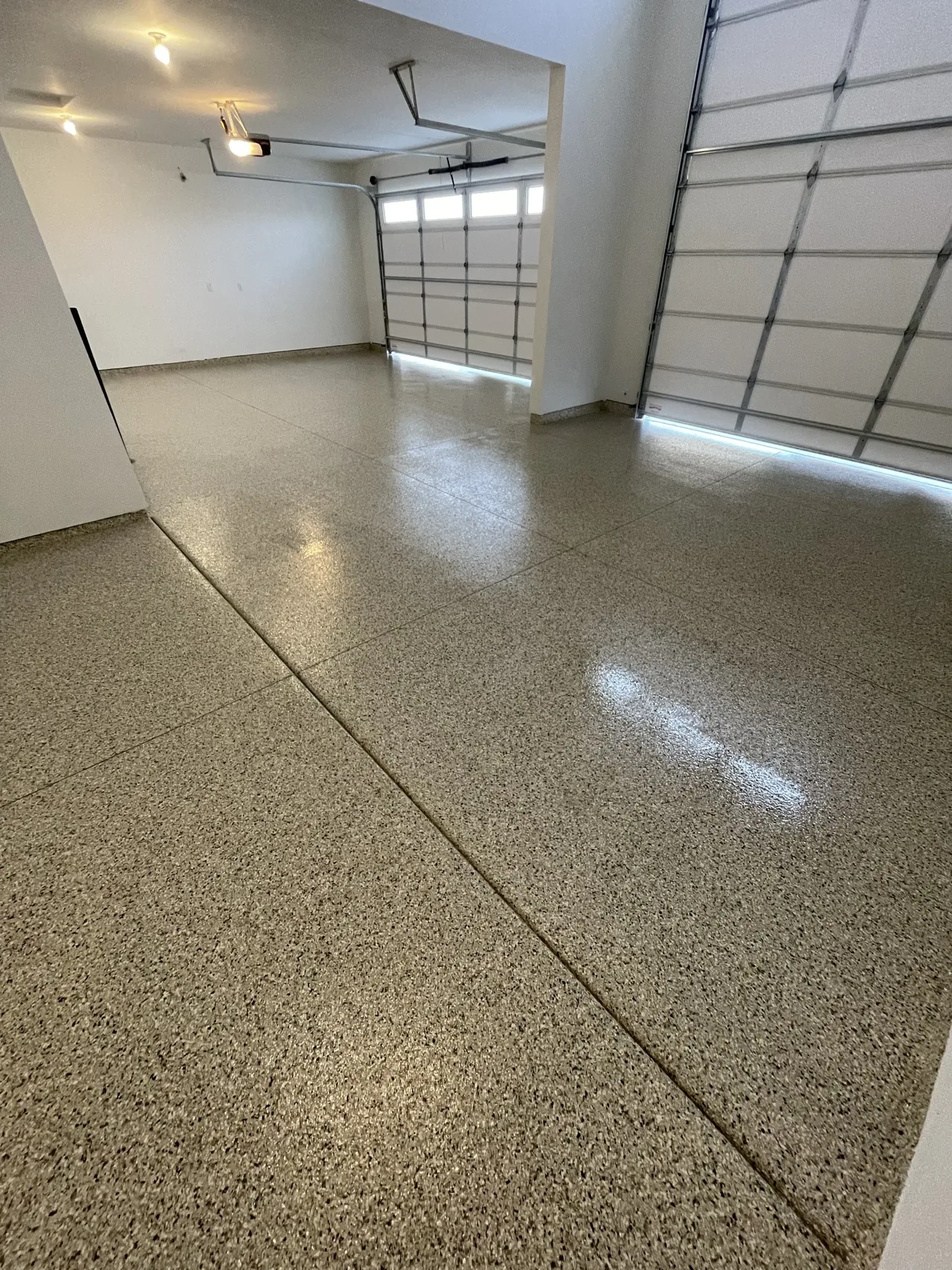 Gray flake floor beside two garage doors