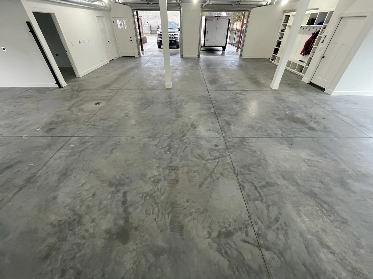 Gray concrete floor across an interior garage space